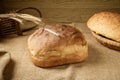 A loaf of homemade white bread on a burlap tablecloth Royalty Free Stock Photo