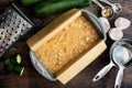 Loaf Pan Filled with Zucchini Bread Batter on a Wood Table Royalty Free Stock Photo