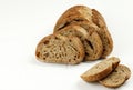 Loaf of Rye Bread Cut into Slices on White Background Royalty Free Stock Photo