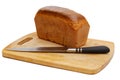 Loaf of rye bread and knife on cutting board on white background Royalty Free Stock Photo