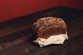 a loaf of rye bread on paper coasters and a board in the background of a wooden table