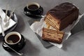 Loaf-shaped chocolate biscuit cake and coffee