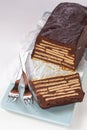 Loaf-shaped chocolate cake with biscuits
