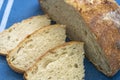 Loaf and slices of freshly baked artisan sourdough bread Royalty Free Stock Photo