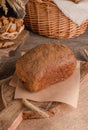 Loaf of traditional rye bread on wooden background
