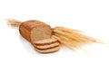 Loaf of wheat bread and shocks of wheat