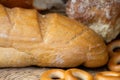 Loaf of white wheat bread, bagels and buns. Close up. Home baker Royalty Free Stock Photo