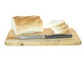 Loaf of white wheat bread sliced on a wooden cutting board and Royalty Free Stock Photo