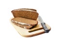 Loaf of wholegrain bread cut on slices on wooden board isolated Royalty Free Stock Photo