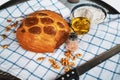 Loaf of wholemeal bread with walnuts, knife, olive oil, salt and flour