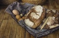 Loafs Of Rye Bread In A Basket With Chicken Eggs On The Table