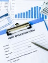 Loan application form document with graph on table Royalty Free Stock Photo