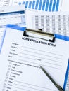 Loan application form document with graph on table Royalty Free Stock Photo