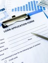 Loan application form document with graph on table Royalty Free Stock Photo