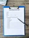 Loan application form document with graph on table Royalty Free Stock Photo