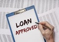 Loan approved inscription on paper. Financial borrowing and lending concept Royalty Free Stock Photo