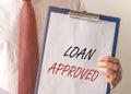 Loan approved inscription on paper. Financial borrowing and lending concept Royalty Free Stock Photo