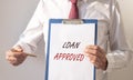 Loan approved inscription on paper. Financial borrowing and lending concept Royalty Free Stock Photo