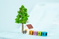 LOAN text and small model house and little tree with notebook, s Royalty Free Stock Photo