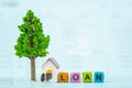 LOAN text and small model house and little tree with notebook, s Royalty Free Stock Photo