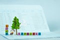 LOAN text and small model house and little tree with notebook, s Royalty Free Stock Photo