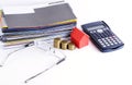 Loans concept with Bill payment and calculator and coins and house paper and eyeglsses