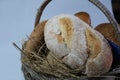 loaves of bread from the bakery in the store. Basket wicker with pastries. Royalty Free Stock Photo