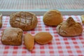 Loaves of bread on a checkered tablecloth Royalty Free Stock Photo