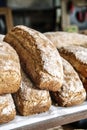 Loaves of bread on the shelves of the shop bakery counter. Fresh, homemade wheat and whole grain breads and pastries. Royalty Free Stock Photo