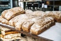 Loaves of bread on the shelves of the shop bakery counter. Fresh, homemade wheat and whole grain breads and pastries. Royalty Free Stock Photo