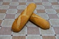 Loaves of bread on a table with checkered tablecloth Royalty Free Stock Photo