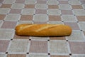 Loaves of bread on a table with checkered tablecloth Royalty Free Stock Photo