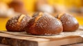 Loaves of whole wheat rye bread on wood board. Yellow background morning sunlight, Bread making concept