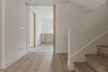 Lobby of a house with smooth white painted walls, staircase steps Royalty Free Stock Photo