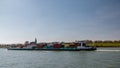 Lobith Netherlands, April 2020, large container vessel on the river rhein near germany with colorful containers on board