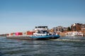 Lobith Netherlands, April 2020, large container vessel on the river rhein near germany with colorful containers on board