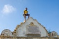 LOBITO, ANGOLA - MAY 09 2014: Unidentified African boy with yellow shirt standing on Reducto Sao Pedro Portuguese fort