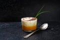 Lobster bisque with a creamy foam soup topping and garnish on a dark slate background, copy space Royalty Free Stock Photo