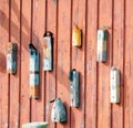 Lobster boat buoys hanging on coastal harbor wall