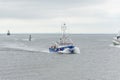 Lobster boat Direction cutting through ferry wake on approach to New Bedford Royalty Free Stock Photo