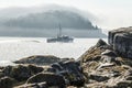 Lobster boat heads out of Bar Harbor on a foggy morning in Maine Royalty Free Stock Photo