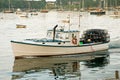 Lobster boat leaving harbor Royalty Free Stock Photo