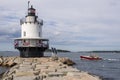 Lobster Boat Passes by Spring Point Lighthouse in Maine.