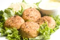 Lobster cakes with lemon wedges tartar sauce