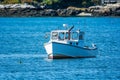 Lobster fishing boat in autumn in coastal Maine, New England Royalty Free Stock Photo