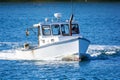 Lobster fishing boat in autumn in coastal Maine, New England