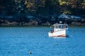 Lobster fishing boat in autumn in coastal Maine, New England Royalty Free Stock Photo