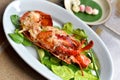 Lobster grilled with spicy thai style dressing sauce.
