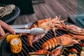 Lobster and mix seafood barbecue cokking on grill