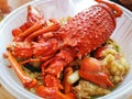 Lobster with noodles in a takeaway food container Royalty Free Stock Photo
